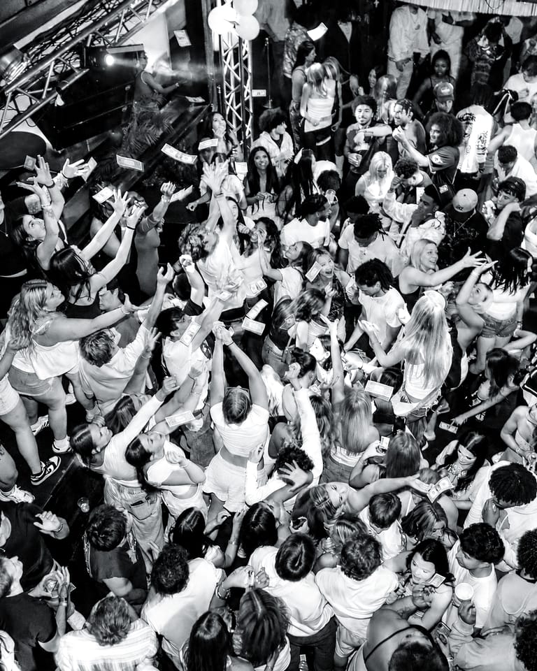 A packed dance floor with hands up during a night at CTRL in downtown Springfield, Missouri.