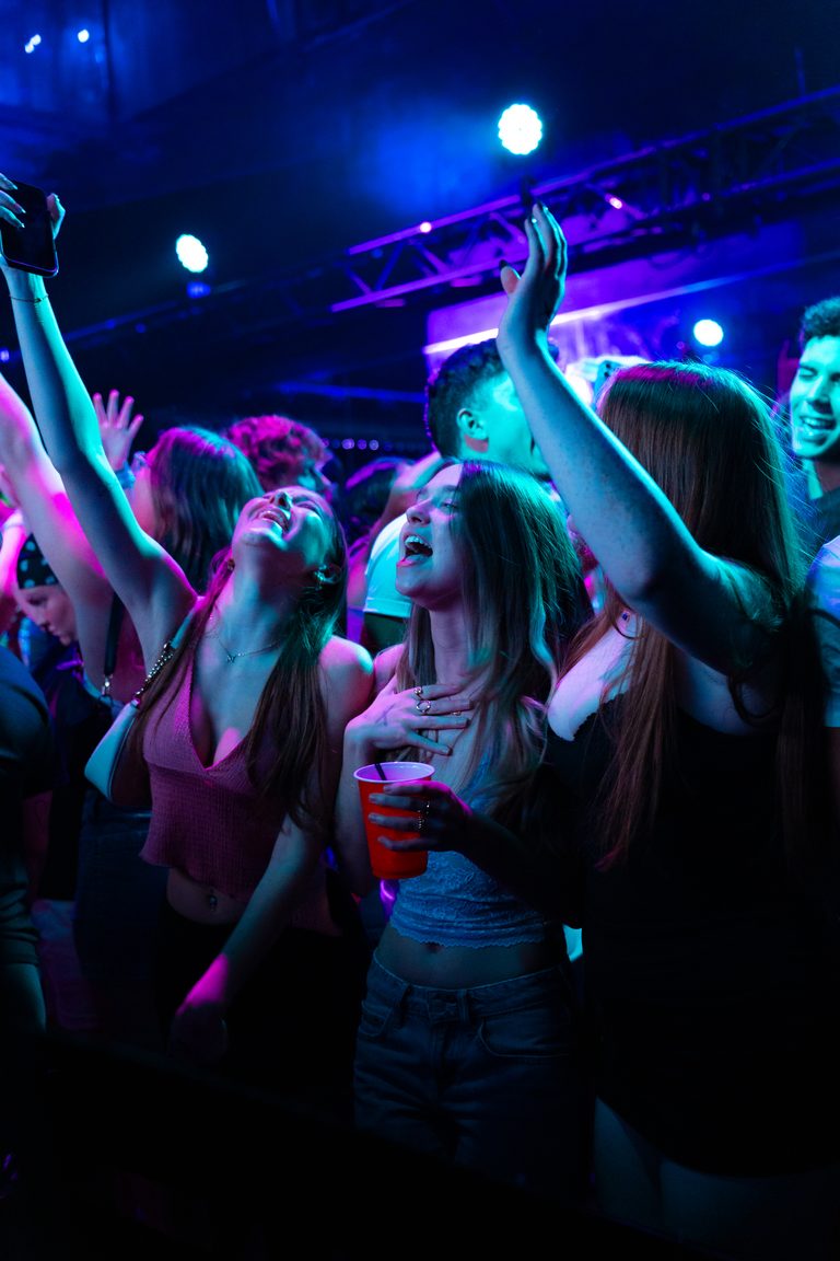 Guests dancing with their hands up on the floor