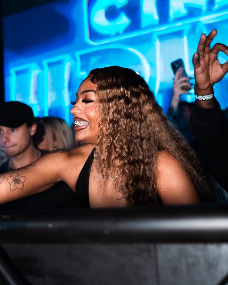 A guest under the CTRL Hip Hop logo on the LED wall