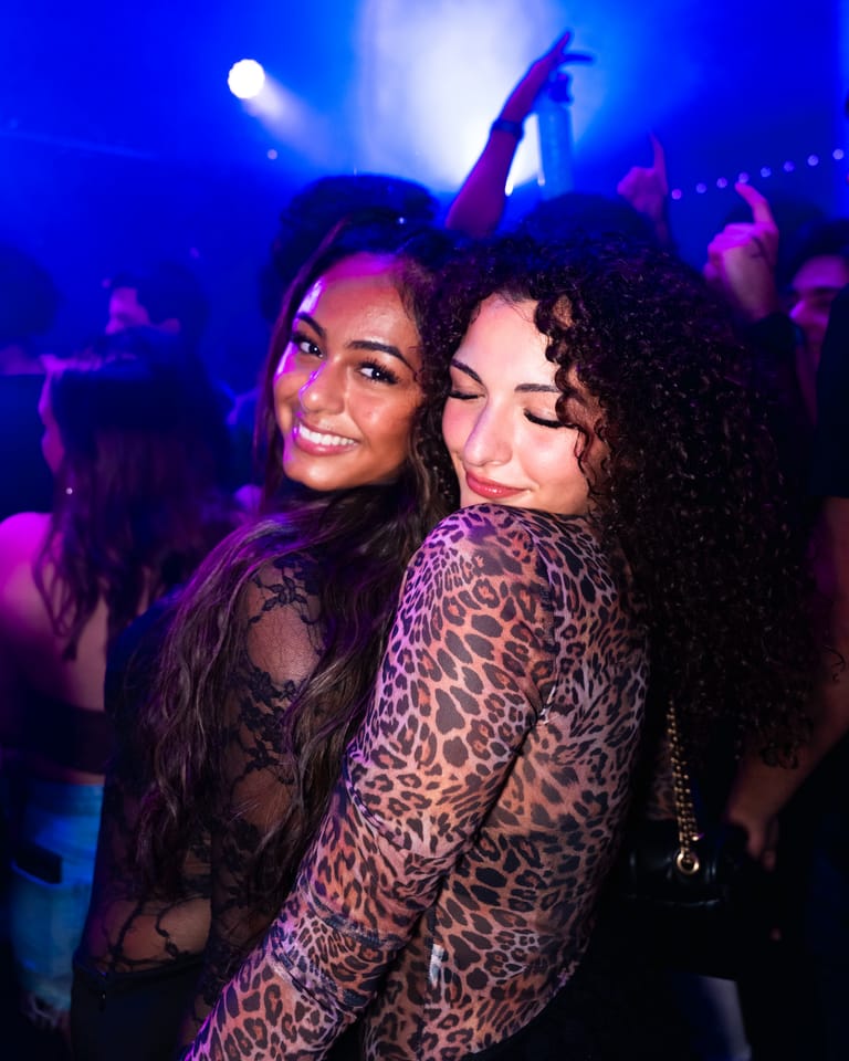 Two friends cheek to cheek on the floor