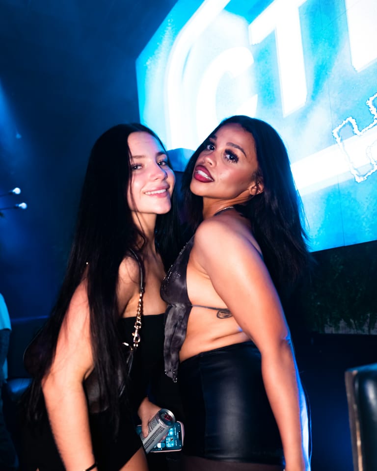 Two friends at the CTRL wall on a Friday night