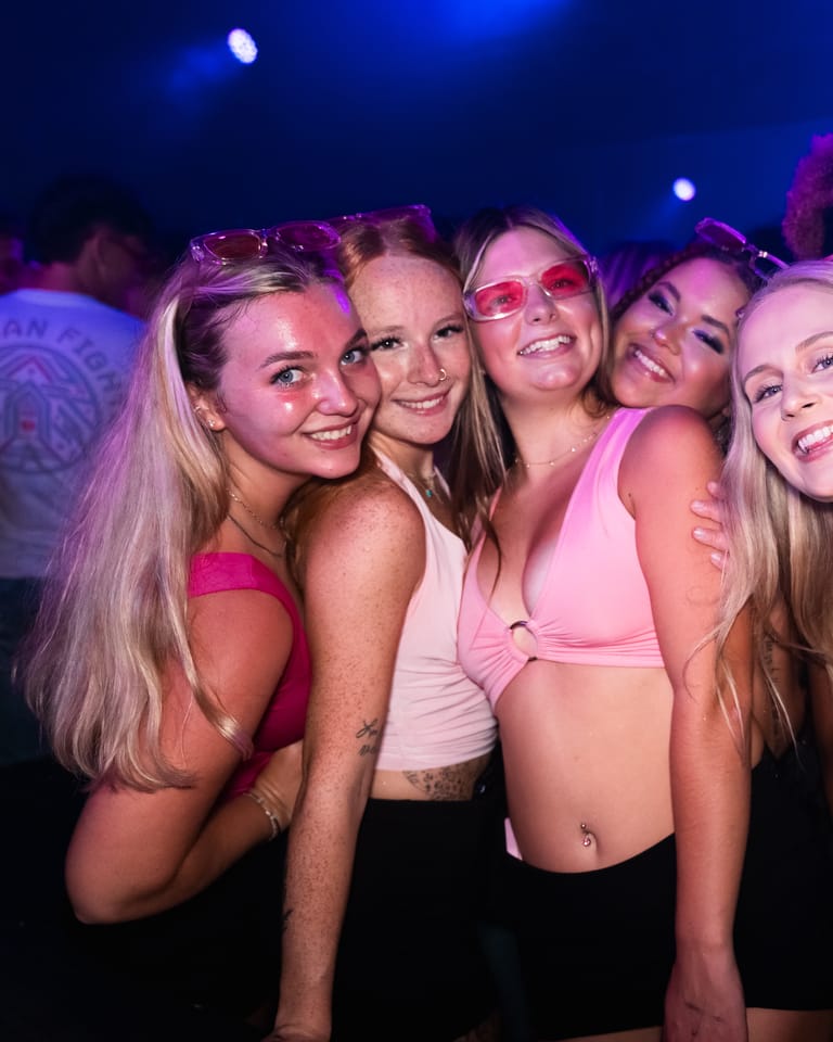 A group of friends together on a themed night