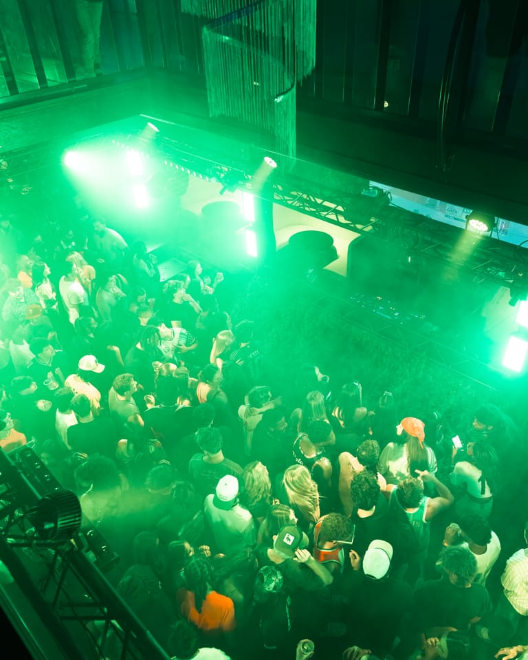 Green lasers overhead in the haze