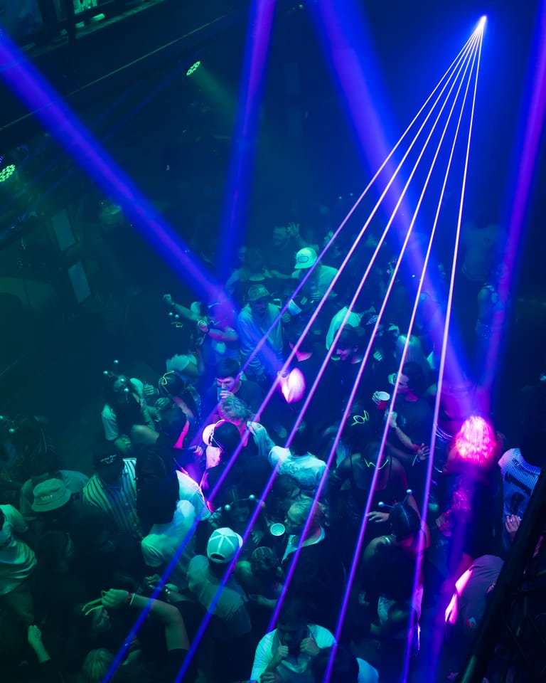 A laser fan spreading over the crowd